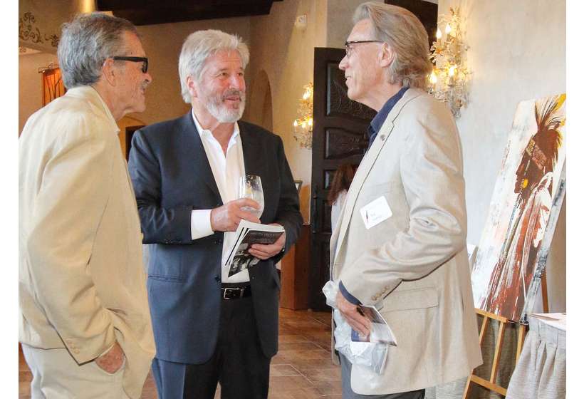 From left, Greg Nelson, David Cook, and Nat Owings in the silent auction area. Owings Gallery donated works to the 2017 and 2019 Galas.